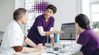 Chronic Purple - three nurses in meeting 