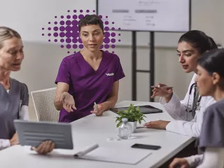 Four nurses in meeting purple 